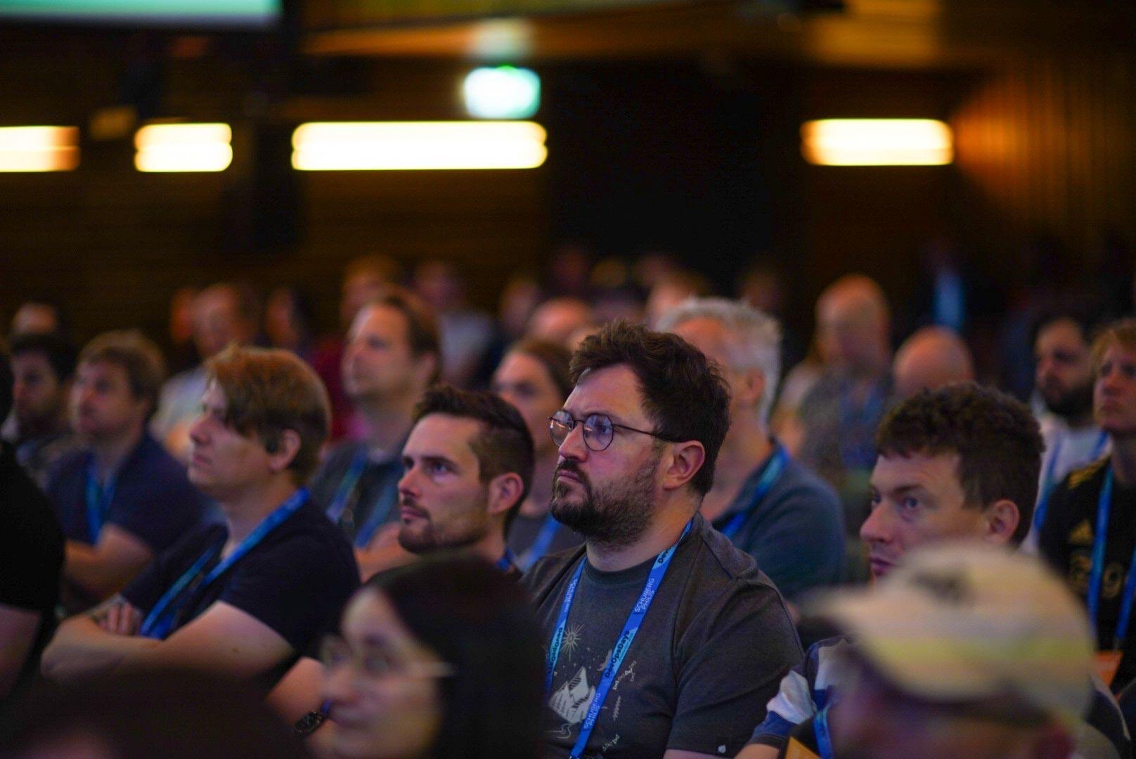 Attendees engaged in discussions at DevOpsDays Amsterdam 2025 conference
